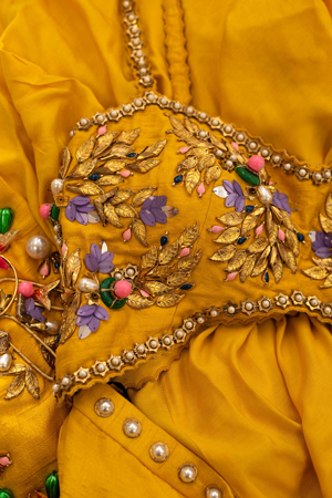Detail of an embroidered fabric with intricate beading